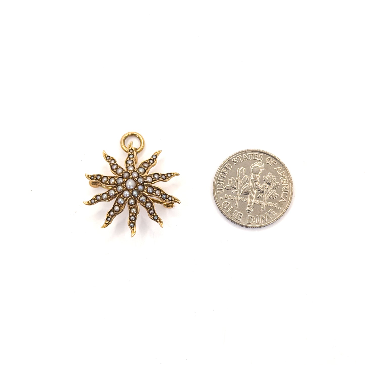 14K Victorian Seed Pearl Star  pendant/brooch next to a U.S. dime on a white background
