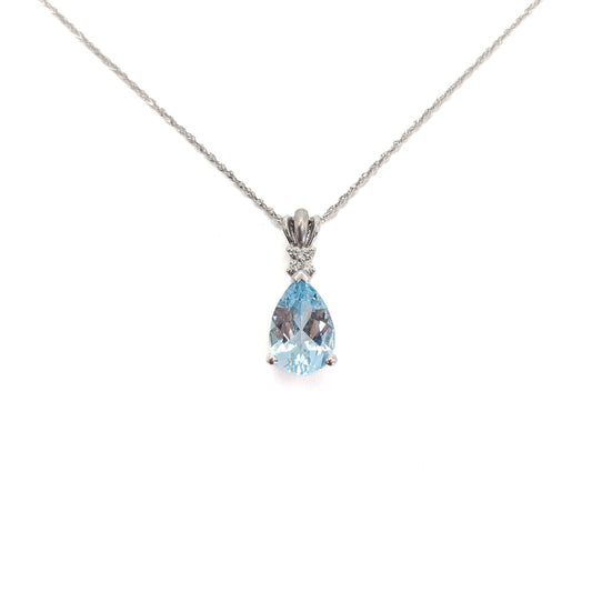 14k white gold necklace with a pear-shaped aquamarine gemstone pendant and diamonds on a white background