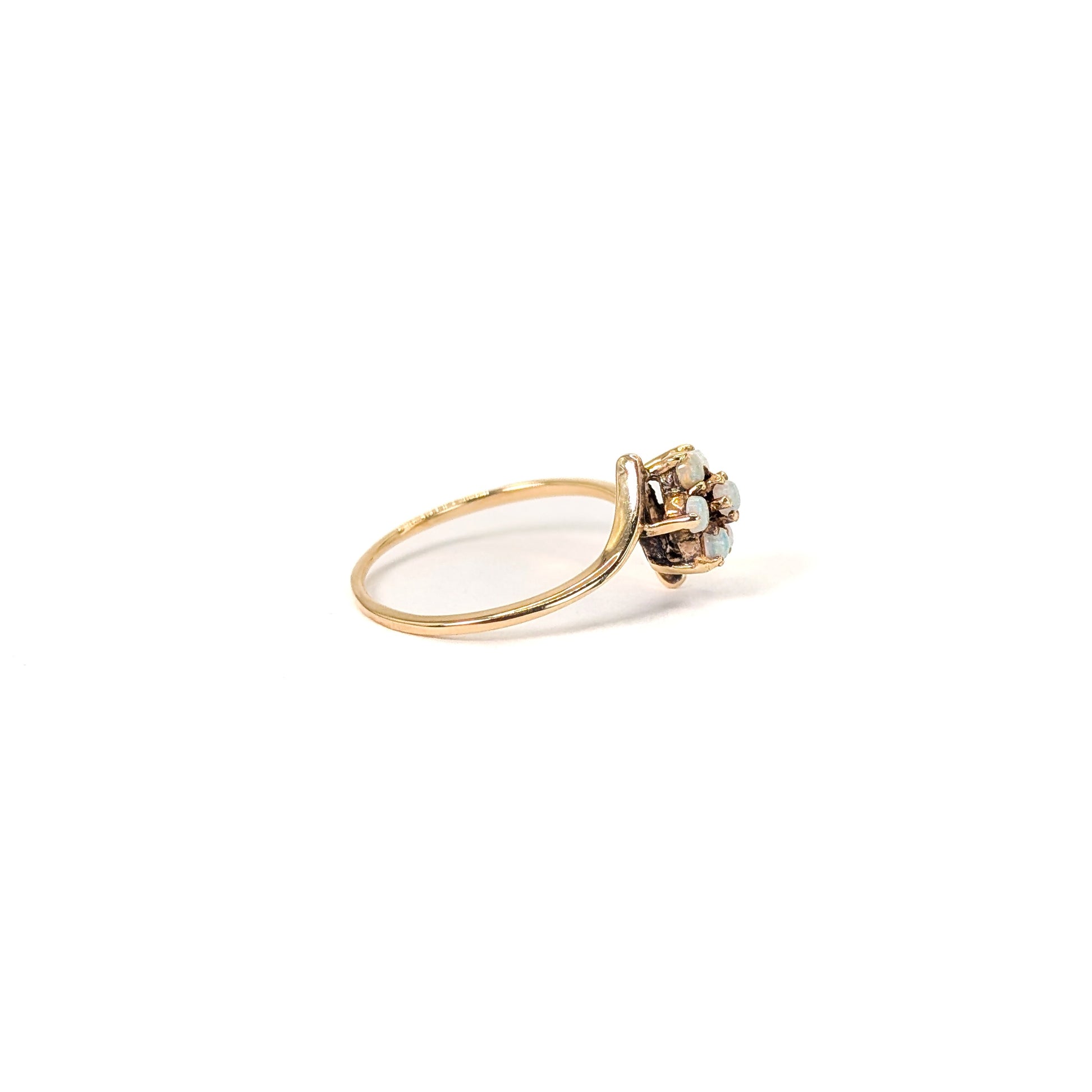 10K Gold ring with opal stones on a white background