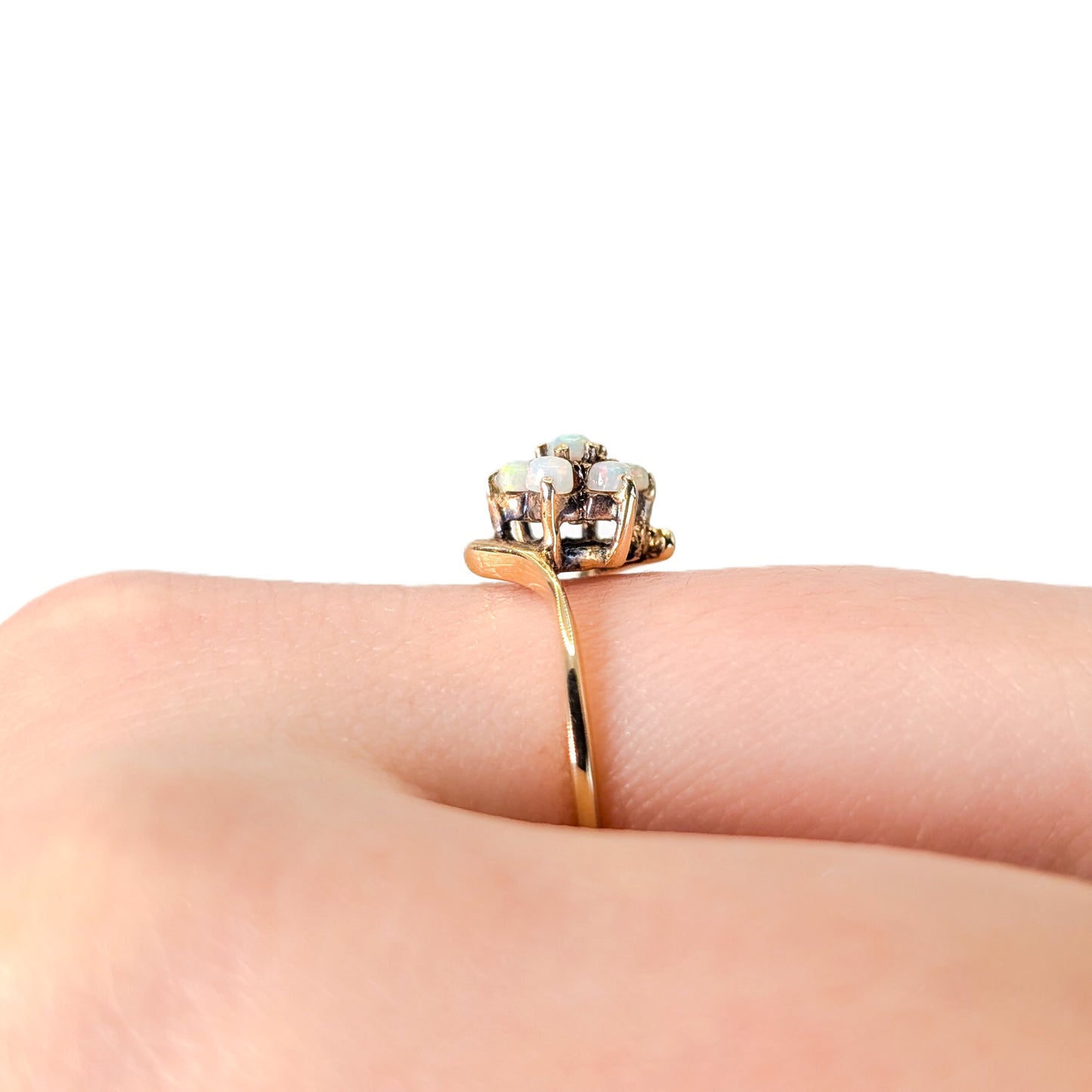 10K Gold ring with opal stones on a white background