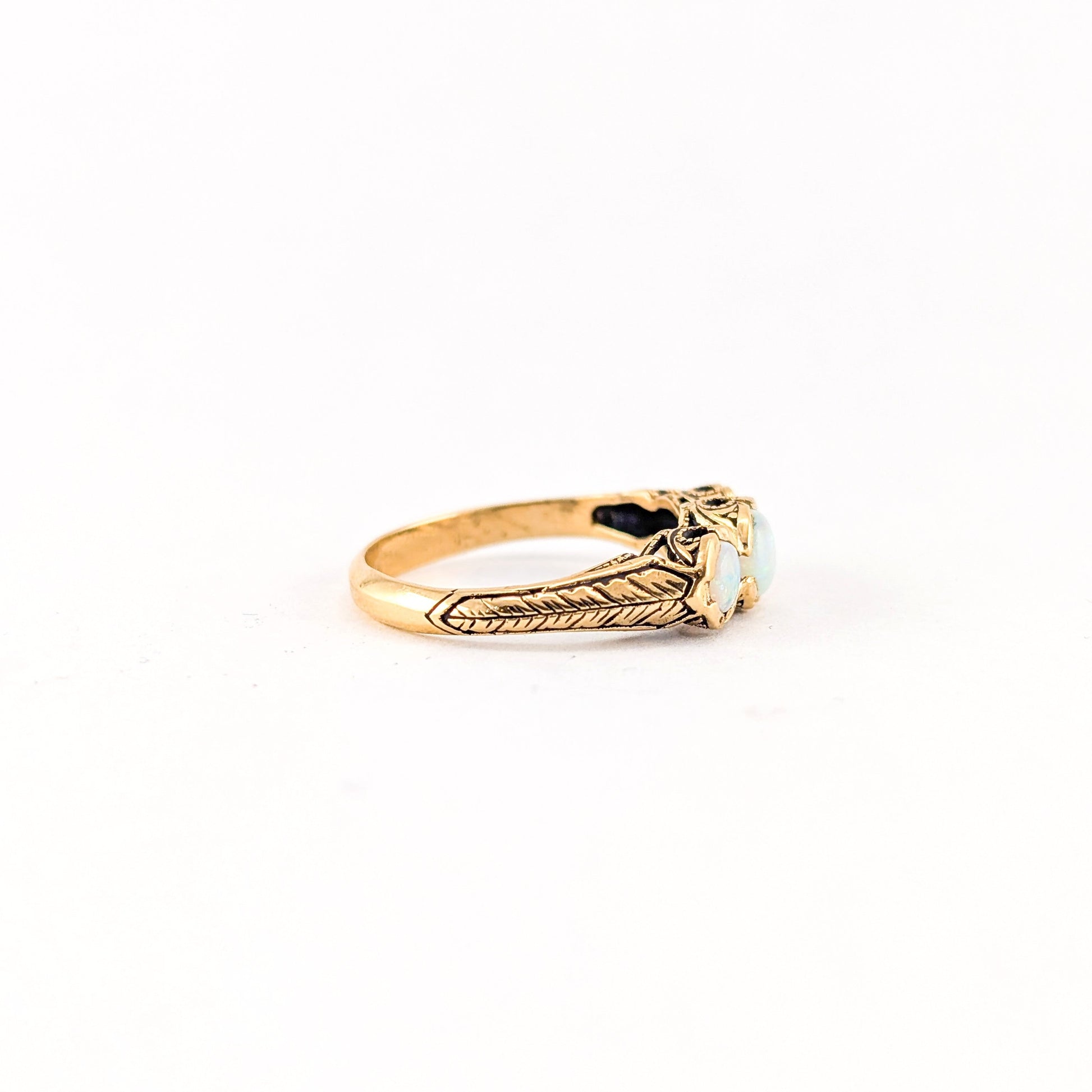 Vintage 9K Gold Three-Stone Opal Ring with Engraved Shoulders
