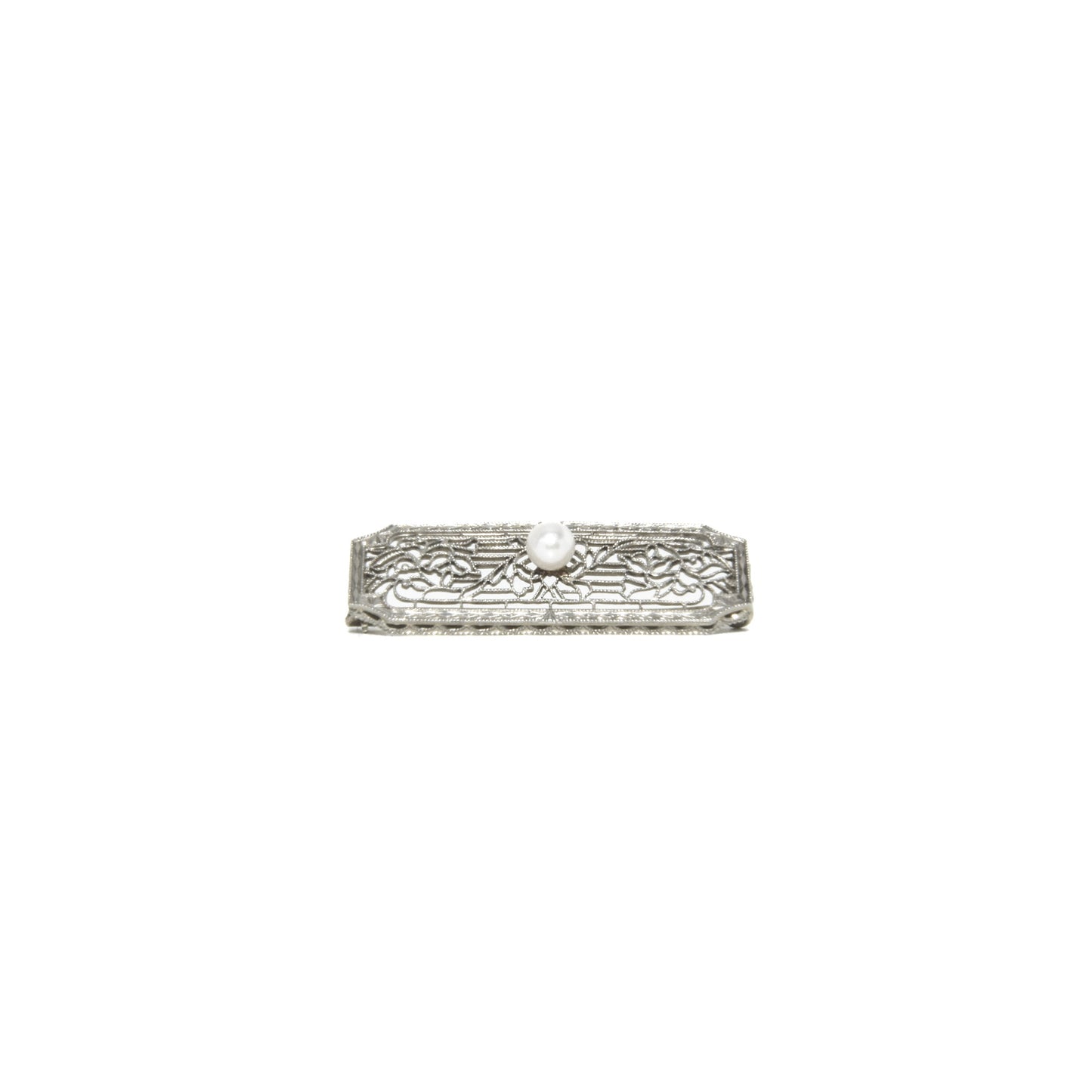 14k white gold art deco brooch with floral design on a white background