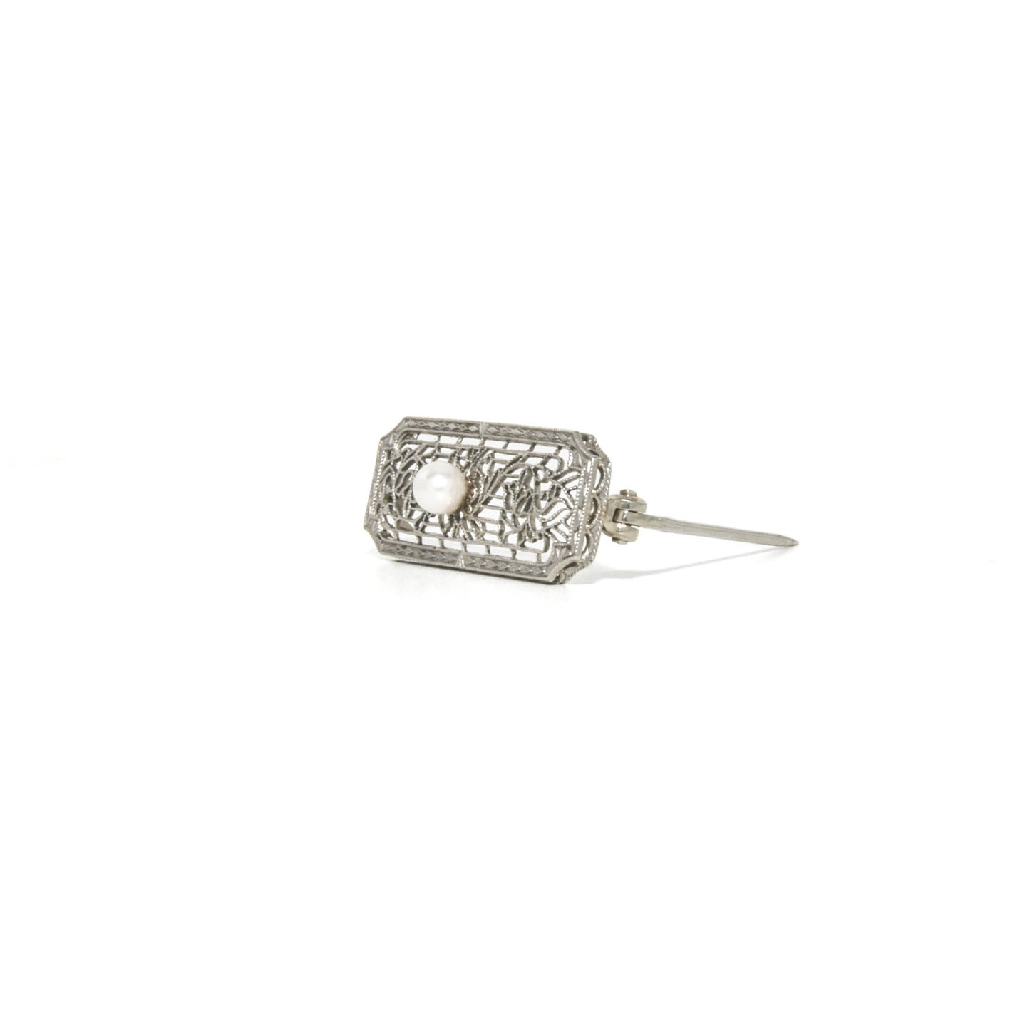 14k white gold art deco brooch with floral design on a white background