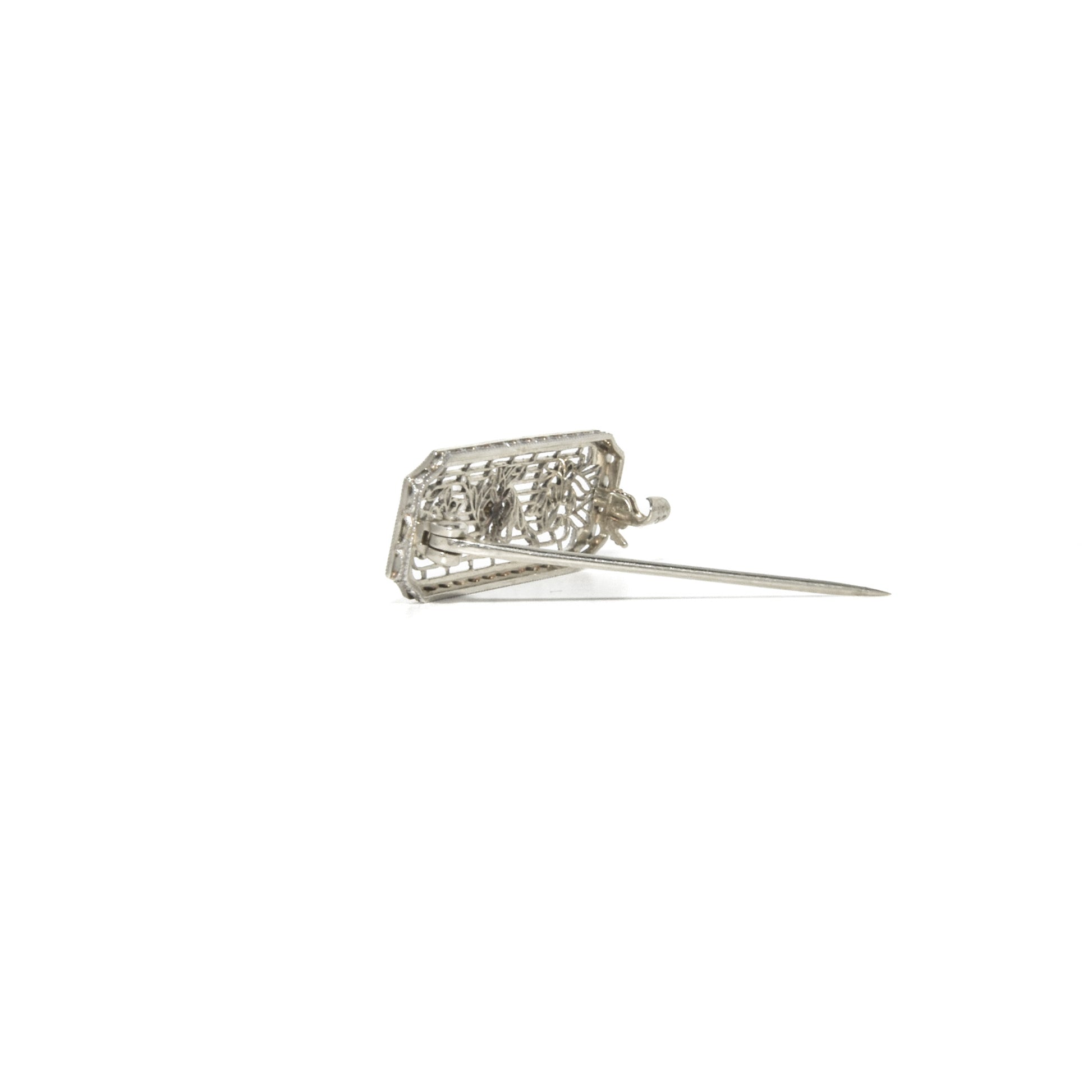 14k white gold art deco brooch with floral design on a white background