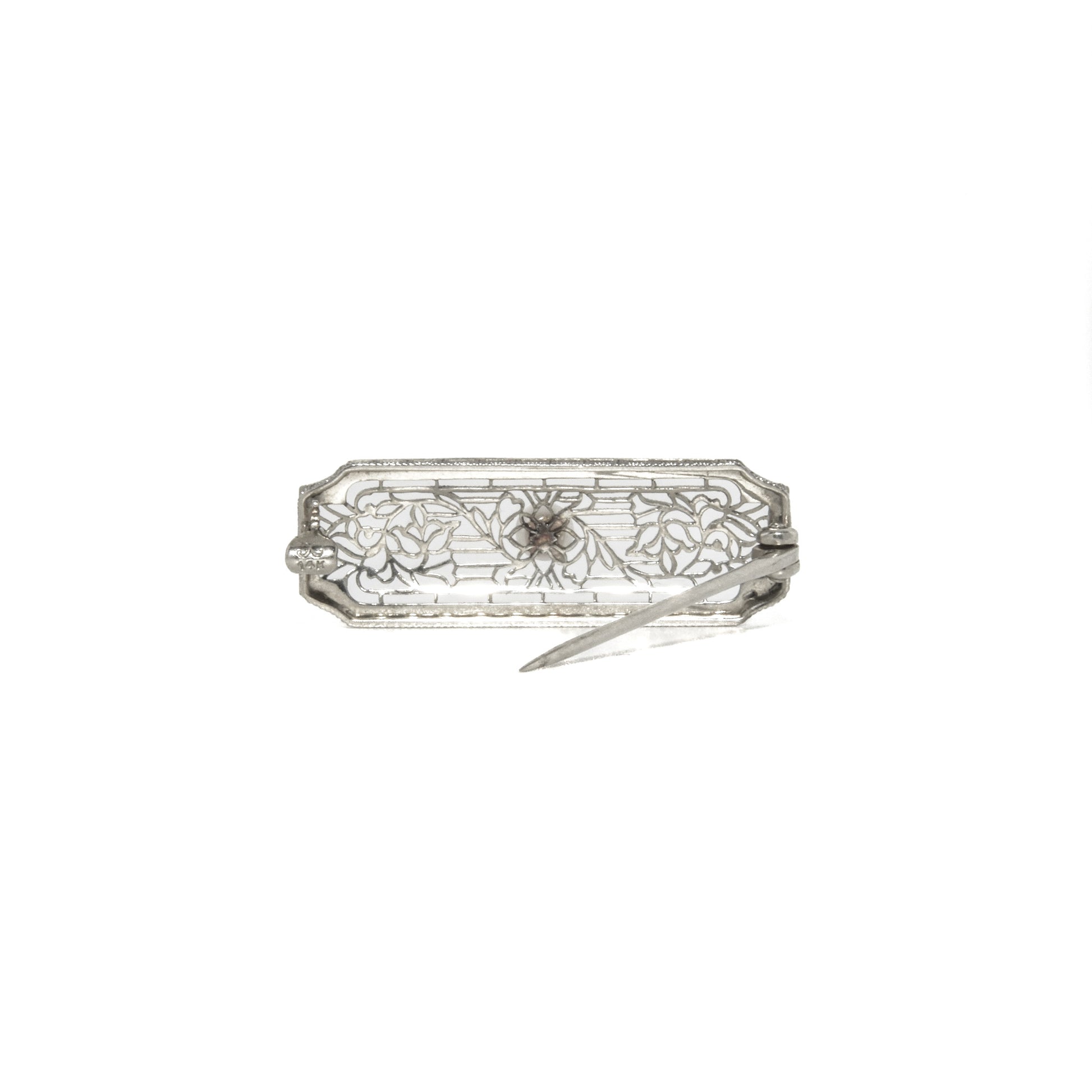 14k white gold art deco brooch with floral design on a white background