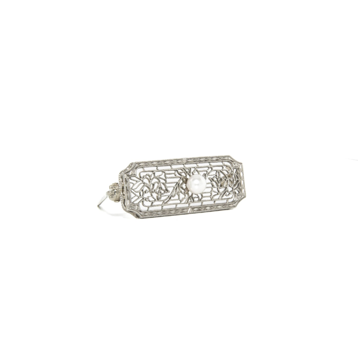 14k white gold art deco brooch with floral design on a white background
