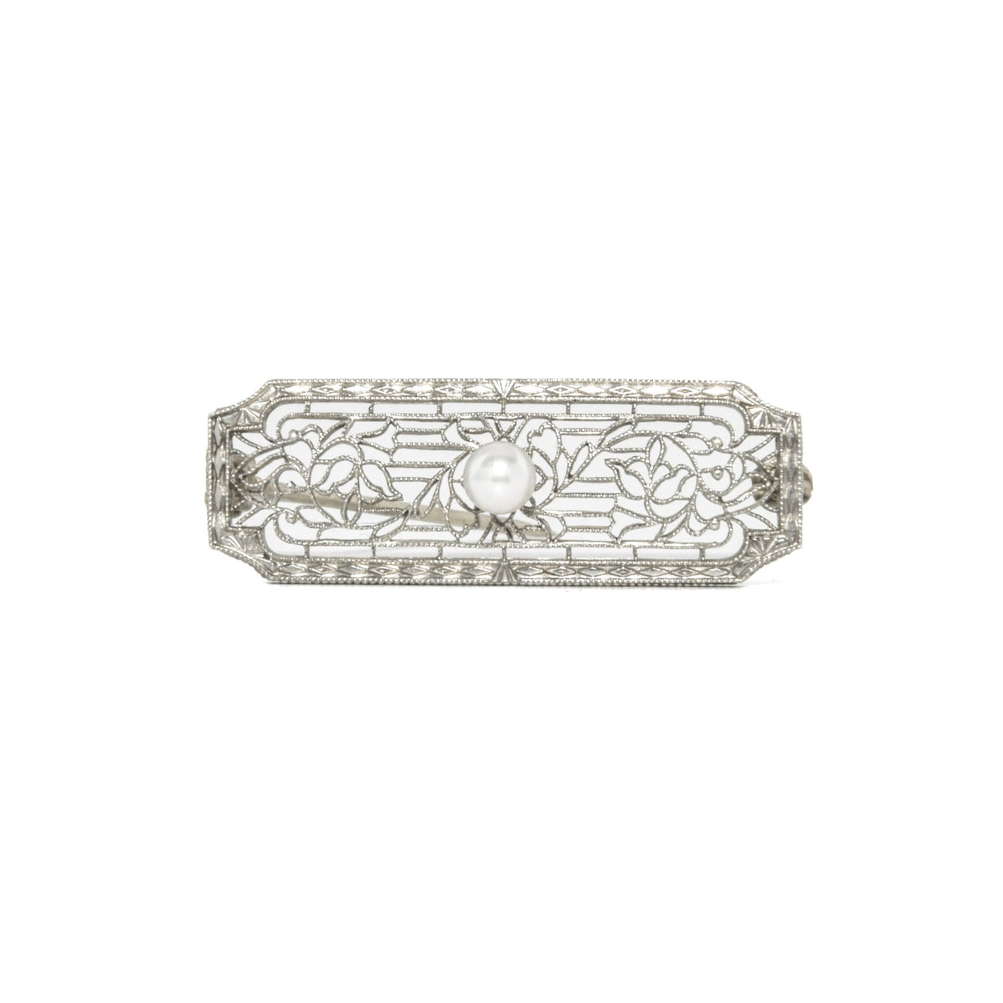 14k white gold art deco brooch with floral design on a white background