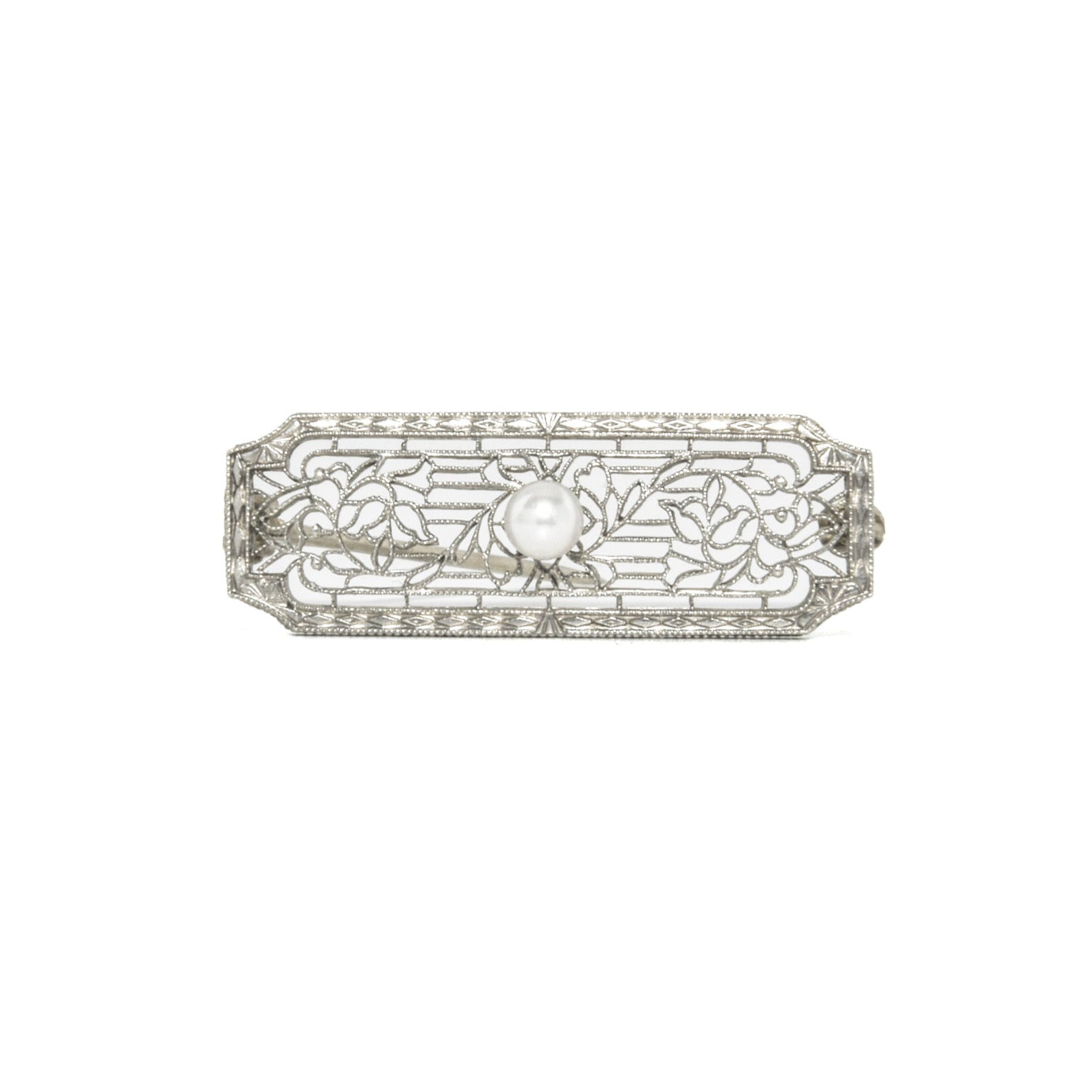 14k white gold art deco brooch with floral design on a white background