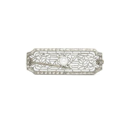 14k white gold art deco brooch with floral design on a white background