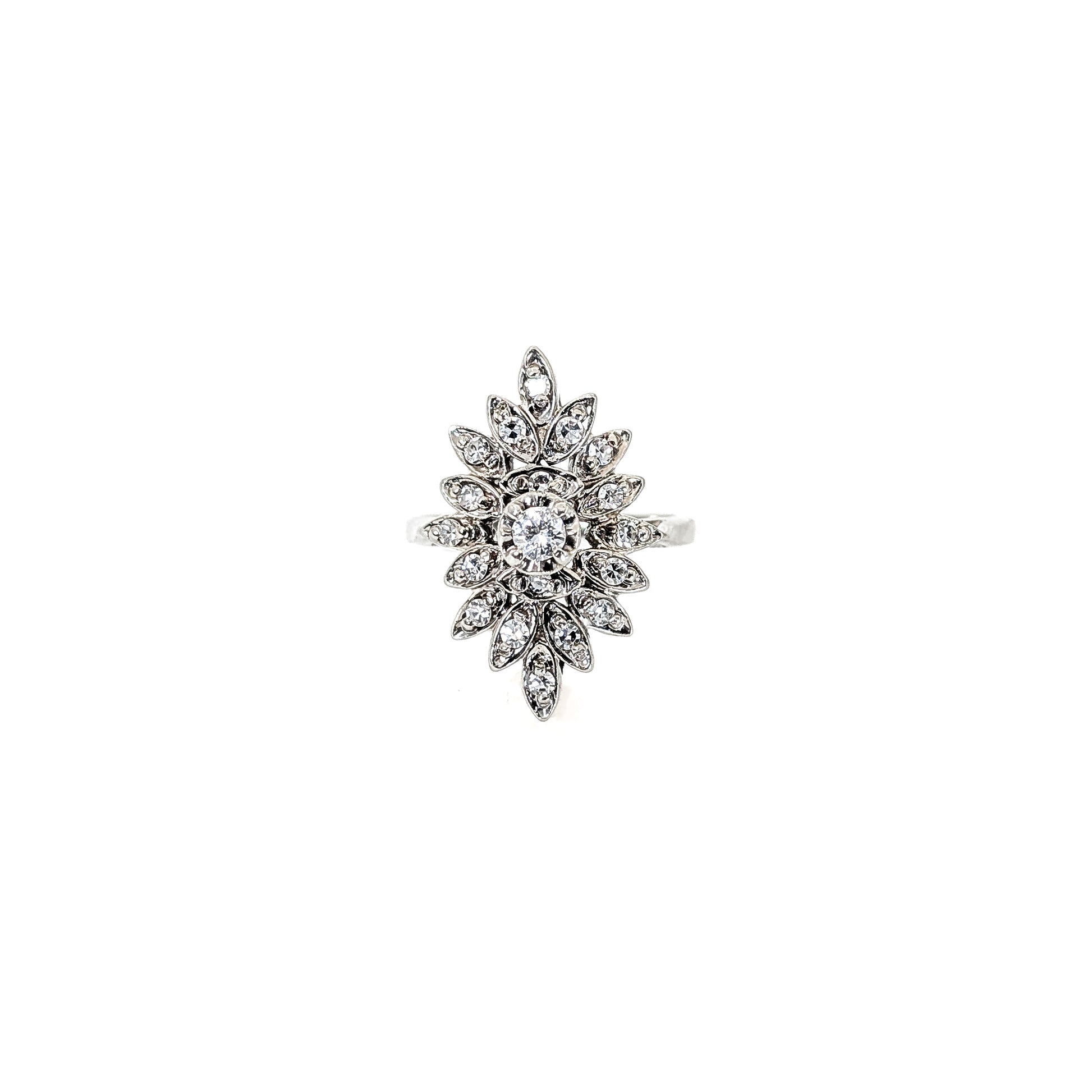 Luminous 14K white gold ring , the design features a brilliant round center diamond surrounded by an intricate halo of marquise-shaped with round diamond accents against a white background.