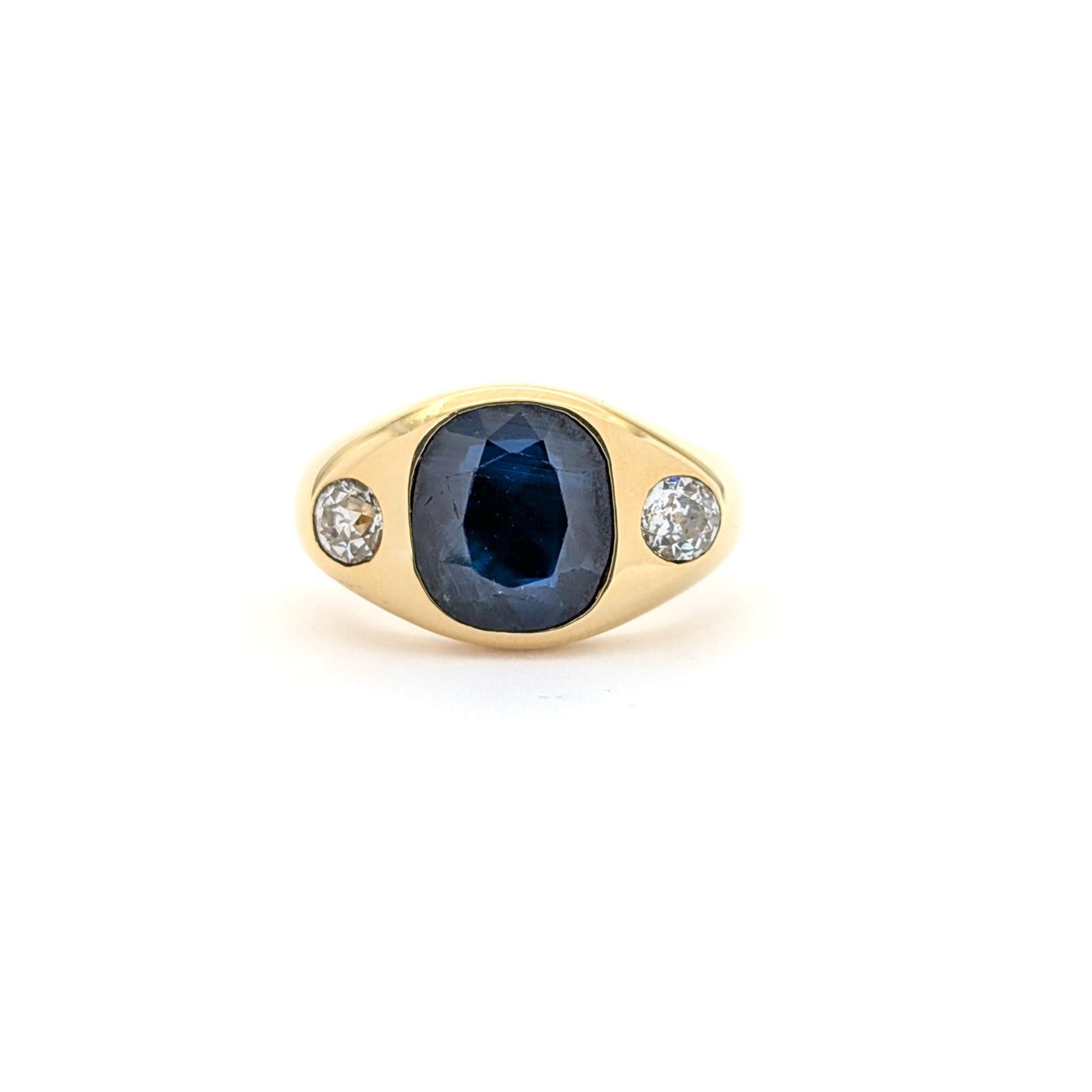 Italian crafted Antique Cushion Cut Blue Sapphire and Old Mine Cut Diamonds Dome Ring in 18K Gold with white background.