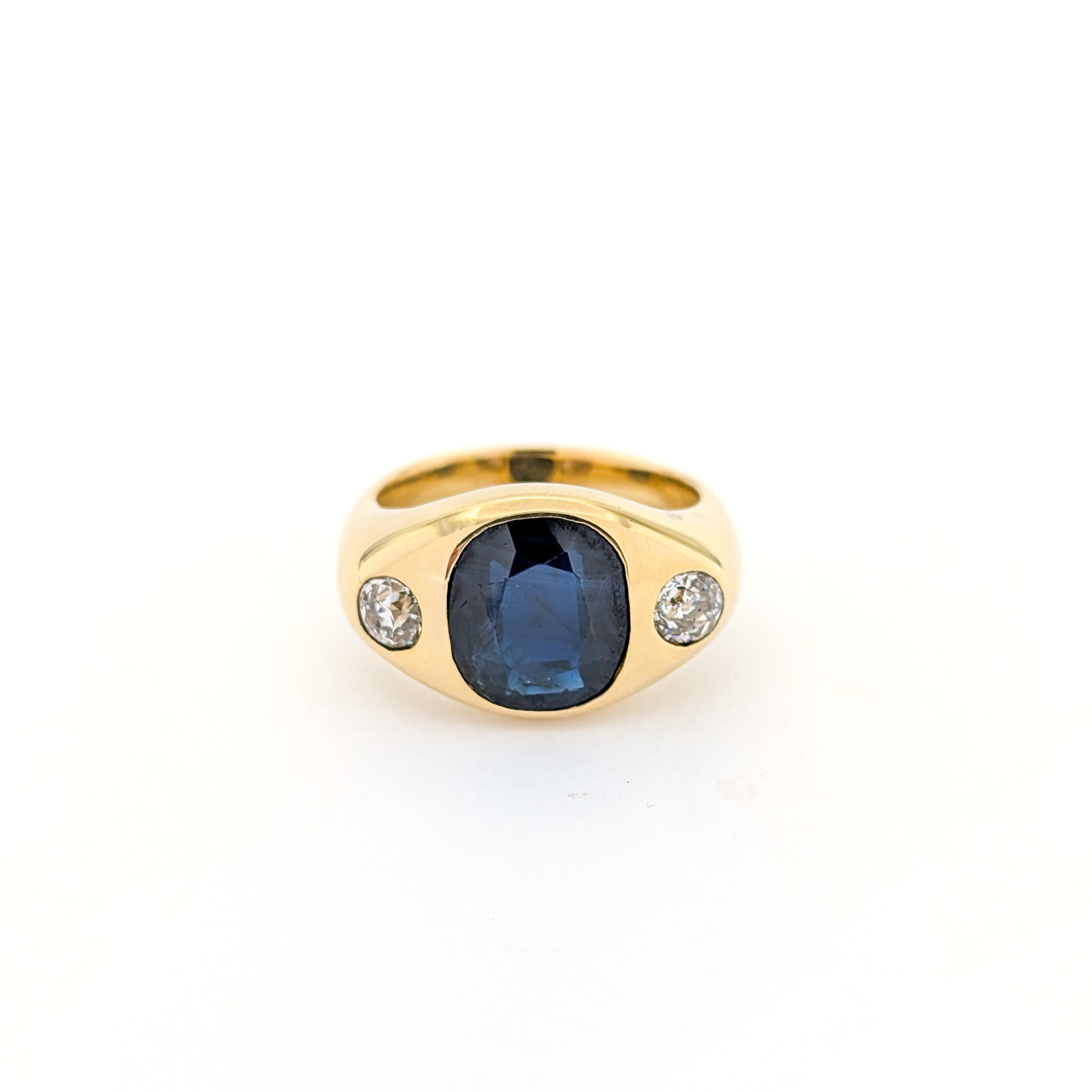 Italian crafted Antique Cushion Cut Blue Sapphire and Old Mine Cut Diamonds Dome Ring in 18K Gold with white background.