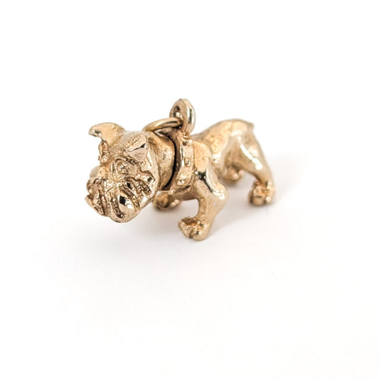 Vintage 14k Gold bulldog mechanical charm on a white background