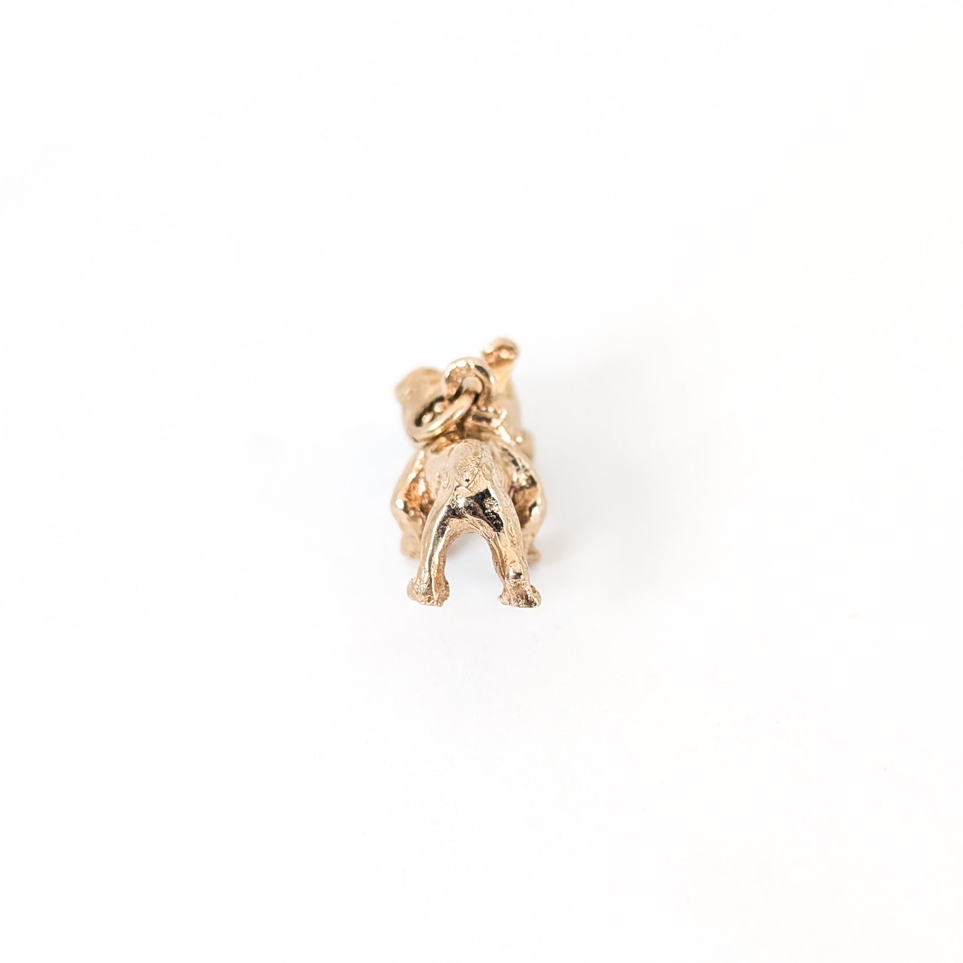 Vintage 14k Gold bulldog mechanical charm on a white background