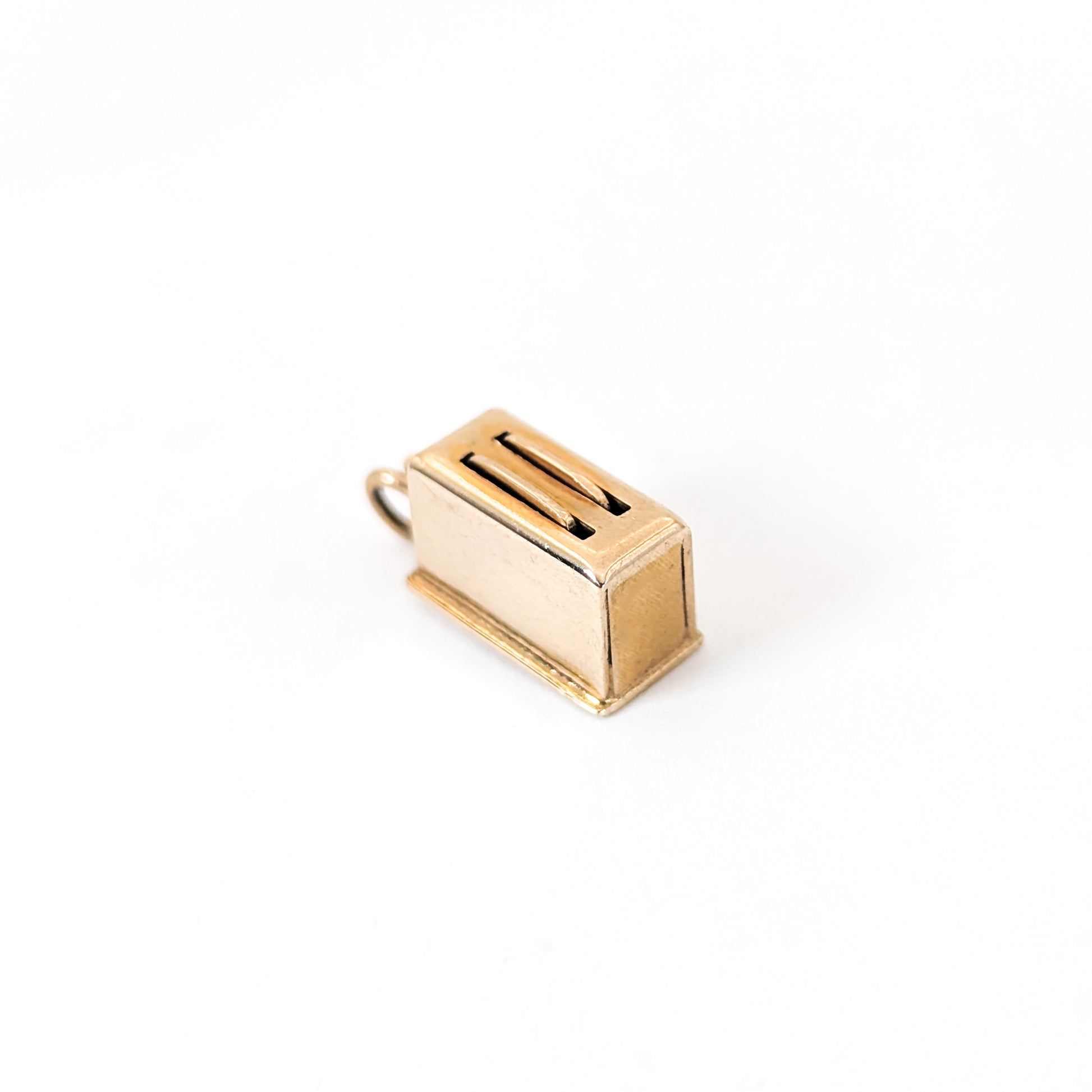 14k Gold toaster mechanical charm on a white background