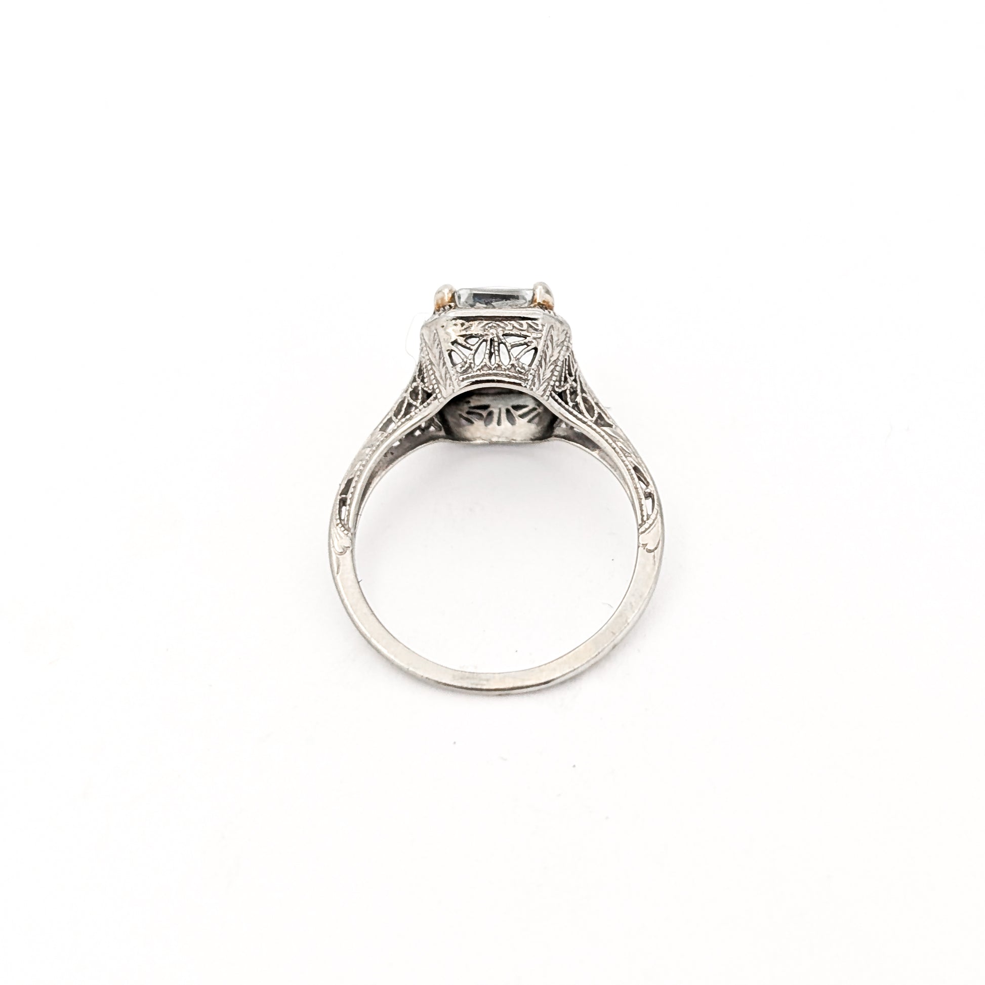 18k white gold ring with a rectangular aquamarine gemstone on a white background