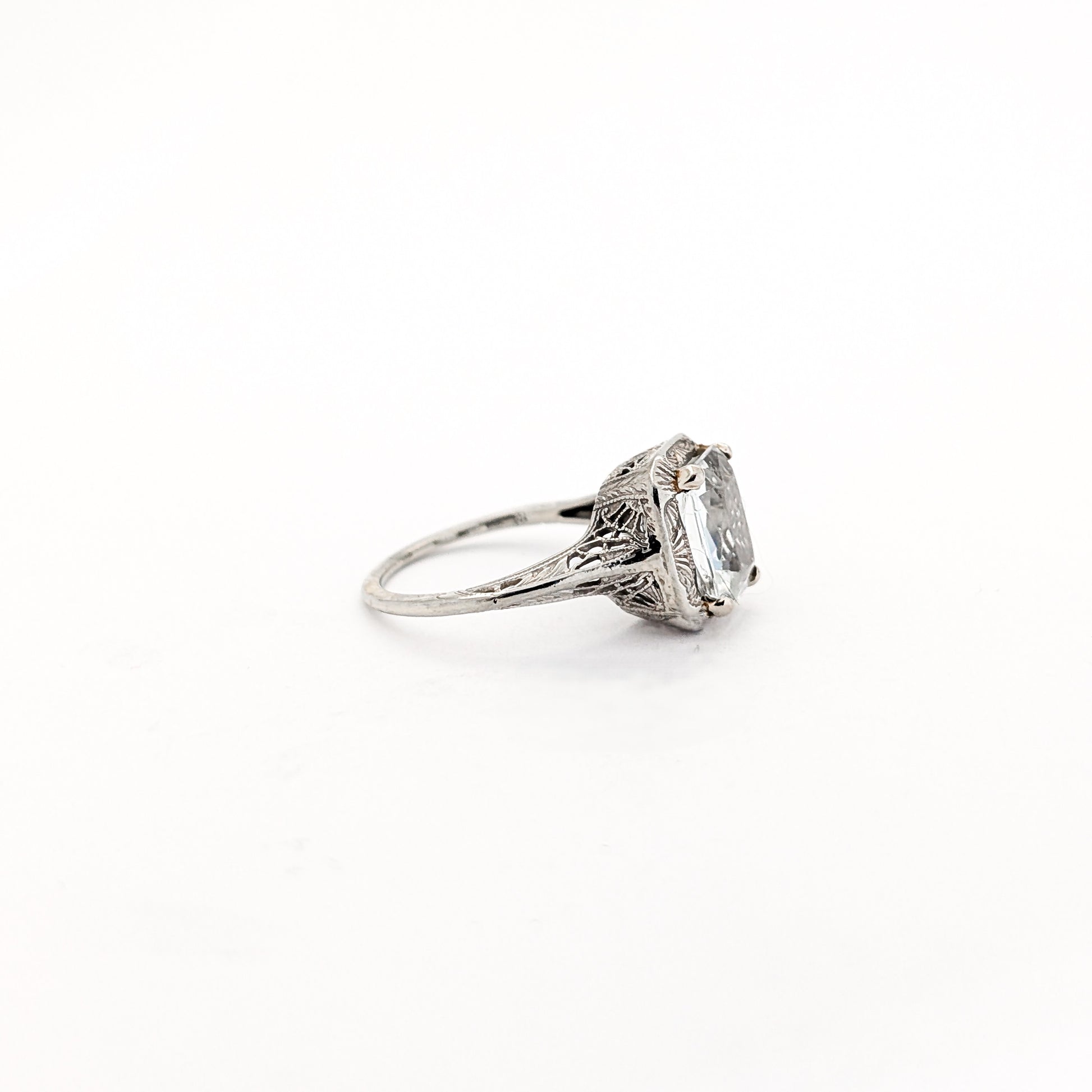 18k white gold ring with a rectangular aquamarine gemstone on a white background