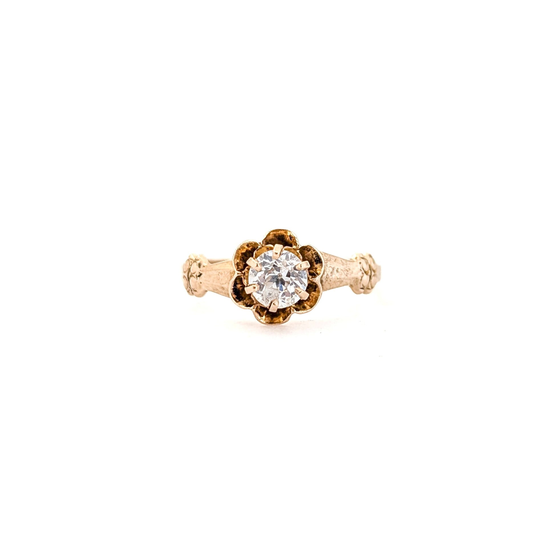 10k Gold ring with a diamond on a white background