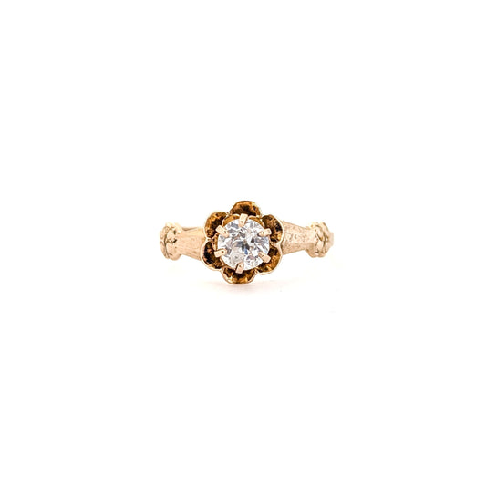 10k Gold ring with a diamond on a white background
