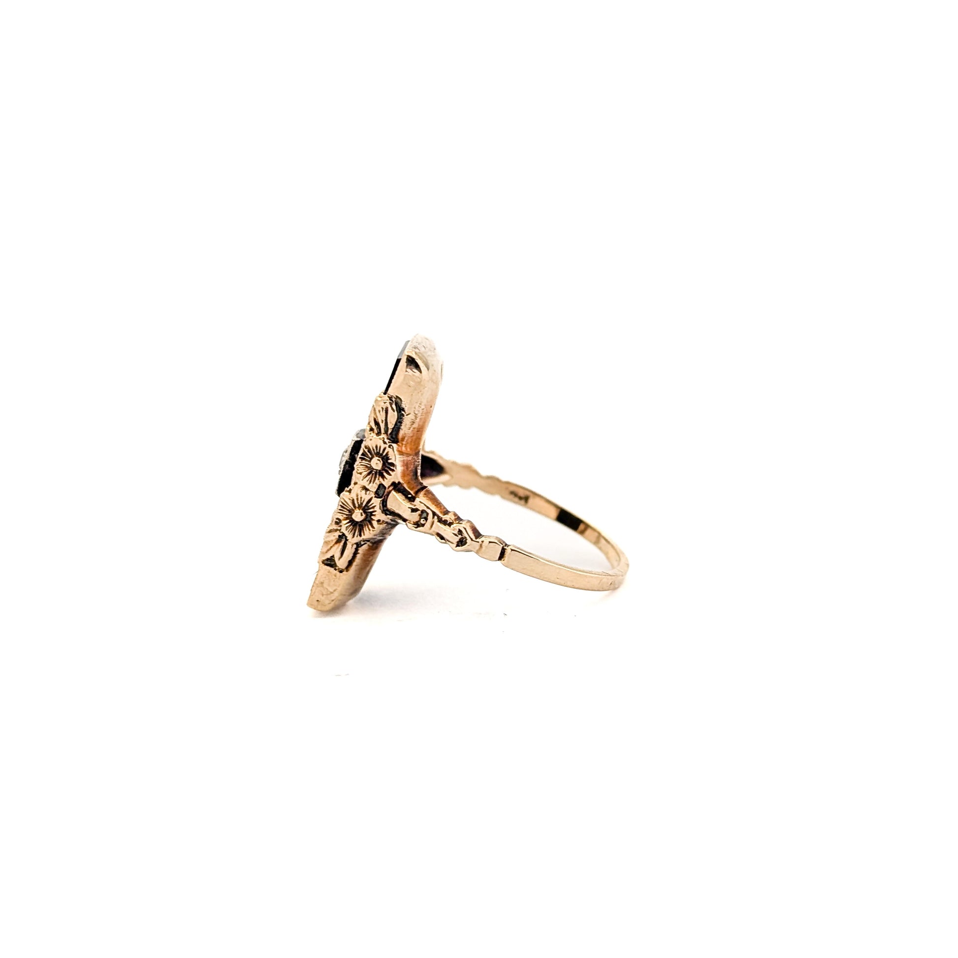 10K Gold Onyx ring with a central diamond on a white background