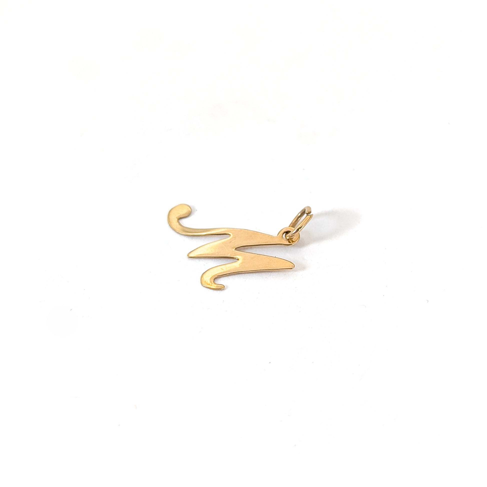 14k Gold pendant with the letter 'M' on a white background