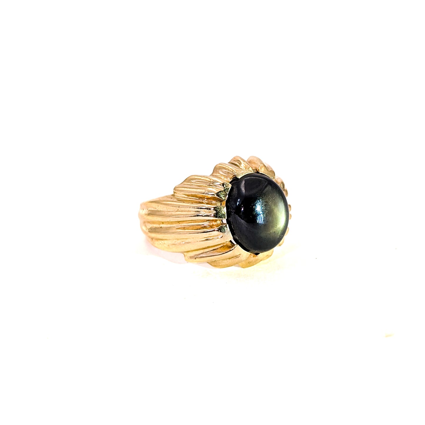 14K gold ring with a black star sapphire gemstone on a white background