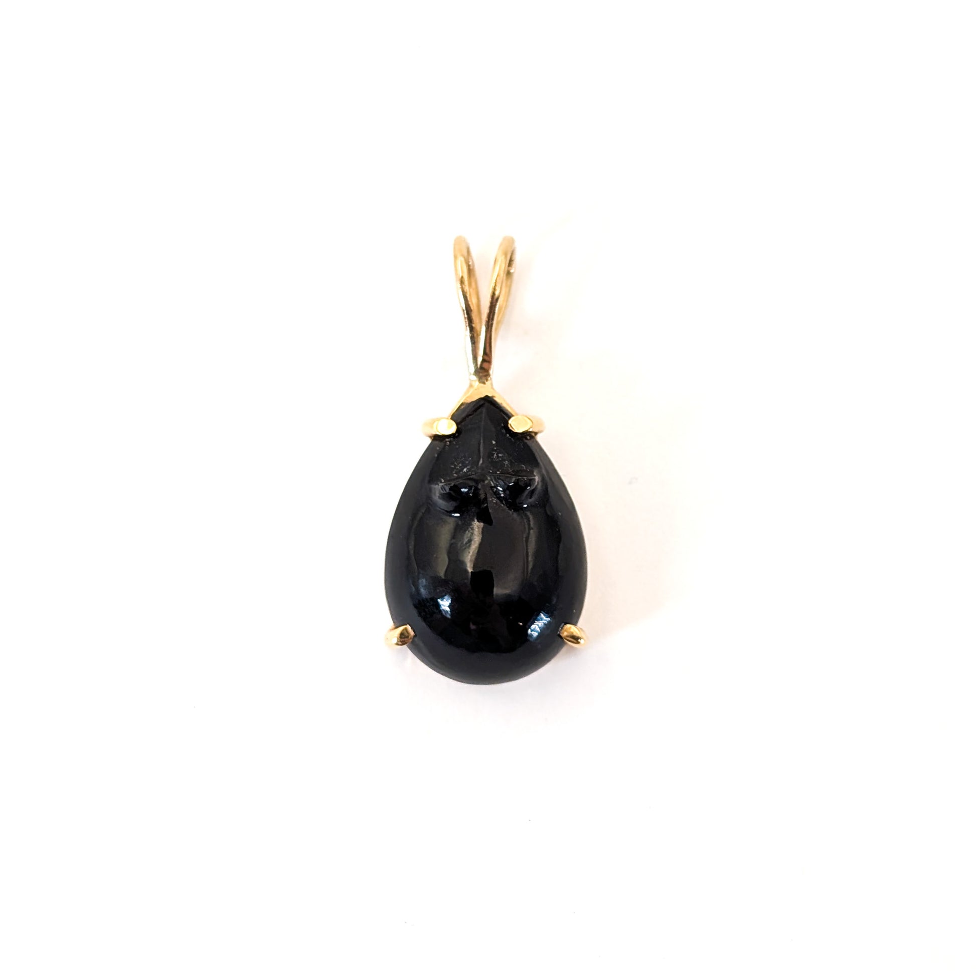 Black onyx teardrop pendant carved in a mouse with 14k gold setting on a white background