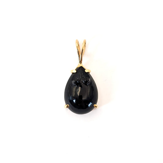 Black onyx teardrop pendant carved in a mouse with 14k gold setting on a white background