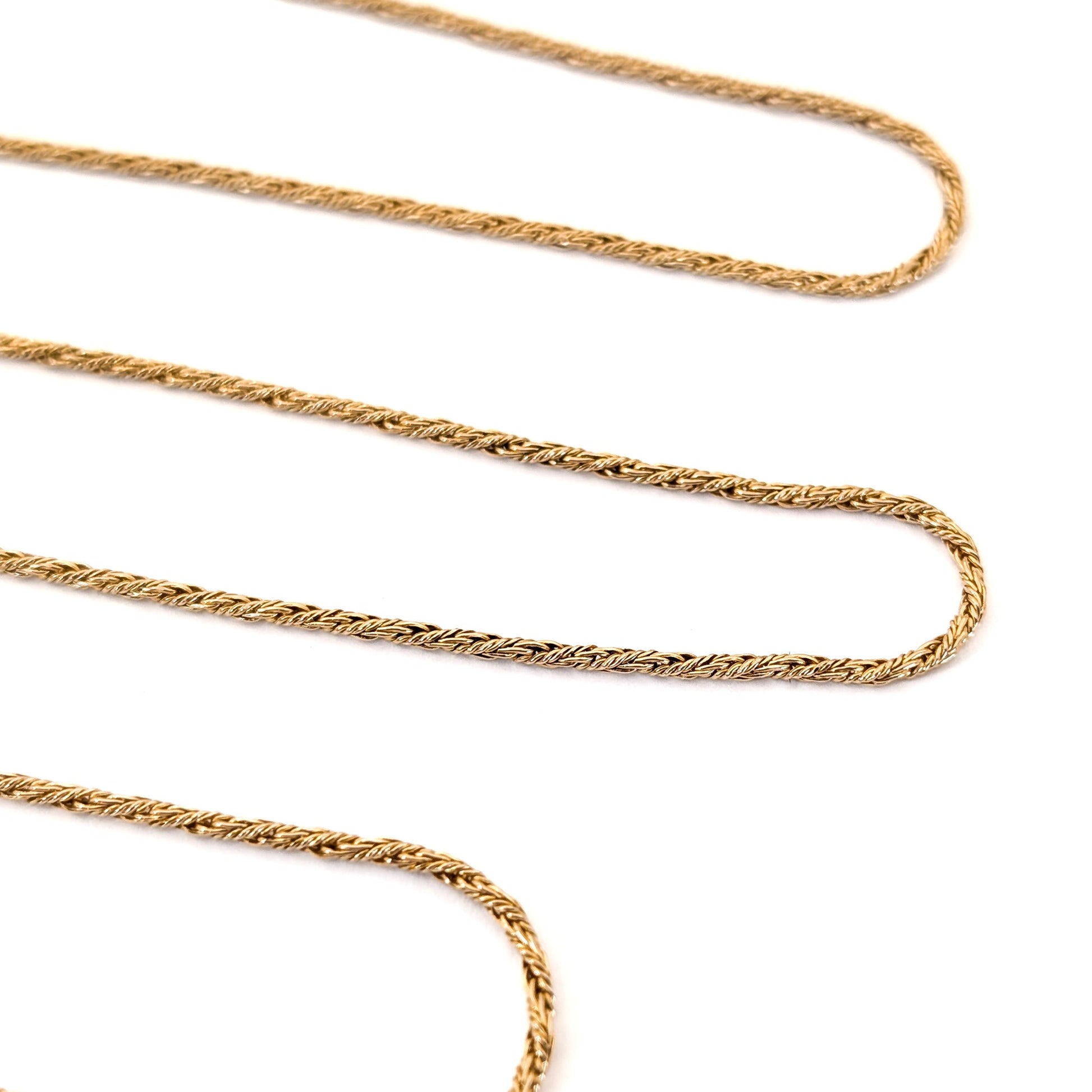 14K Gold chain necklace on a white background