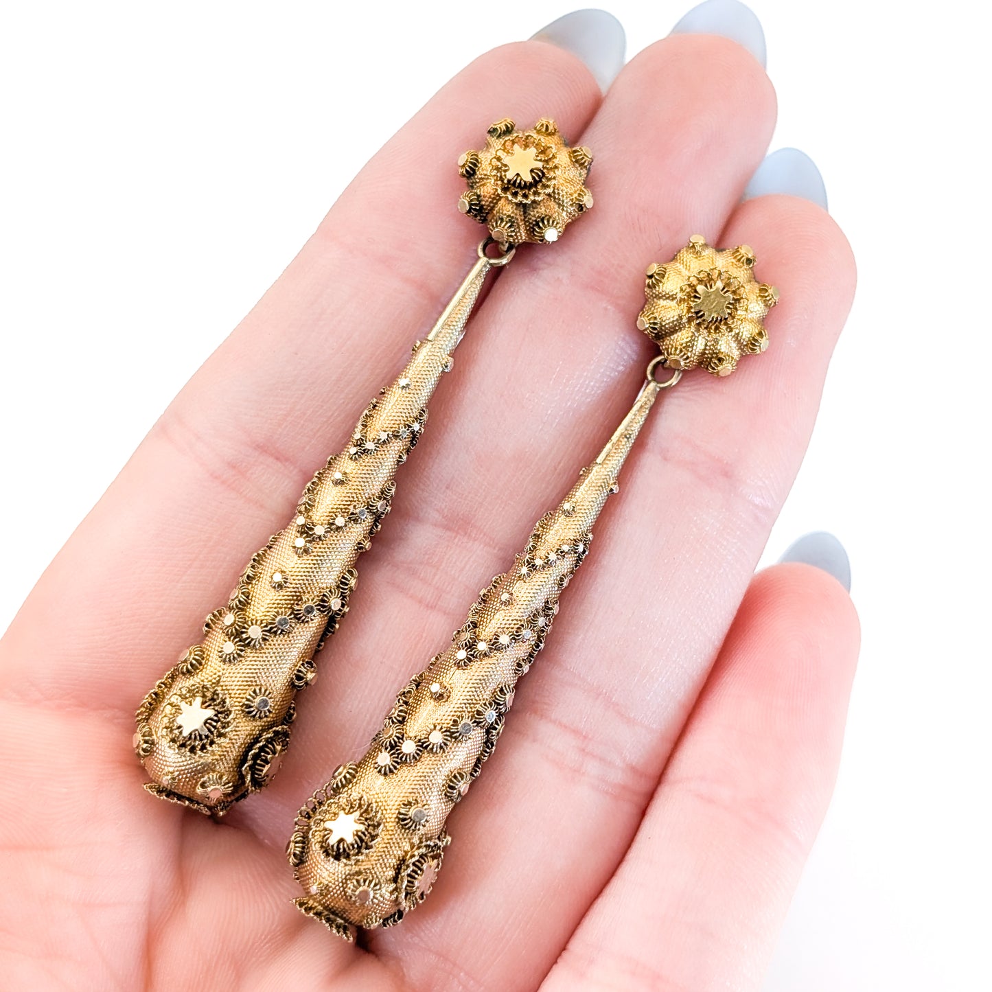 Pair of gold Georgian-era earrings with intricate designs on a white background. Crafted in solid 14K yellow gold, they feature the highly skilled and delicate art of cannetille work, They are a breathtaking example of early 19th-century goldsmithing.